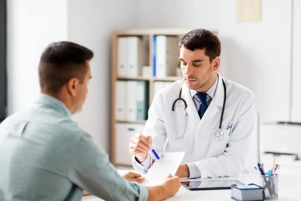 a doctor writing a prescription for a patient