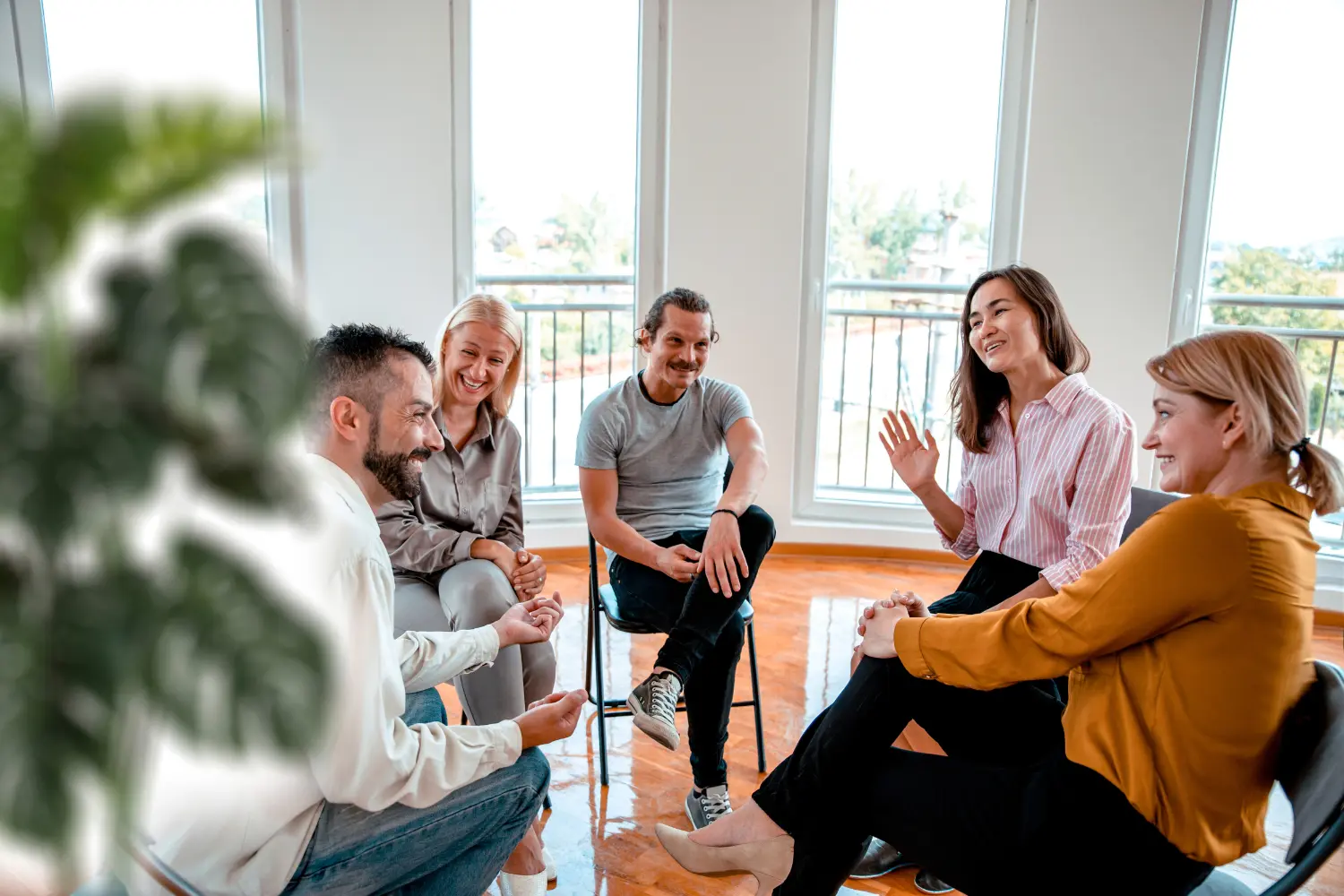 a group of happy people in group therapy