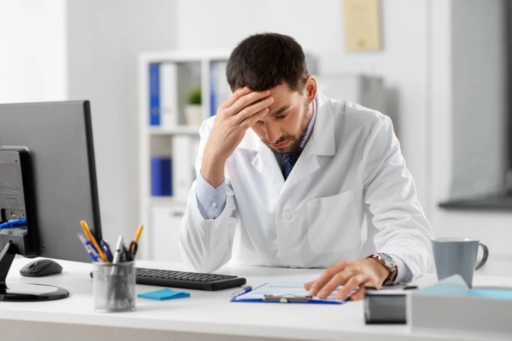 Stressed doctor at a desk