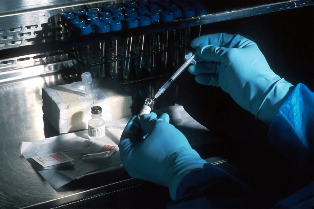 Technician running a drug test in a lab