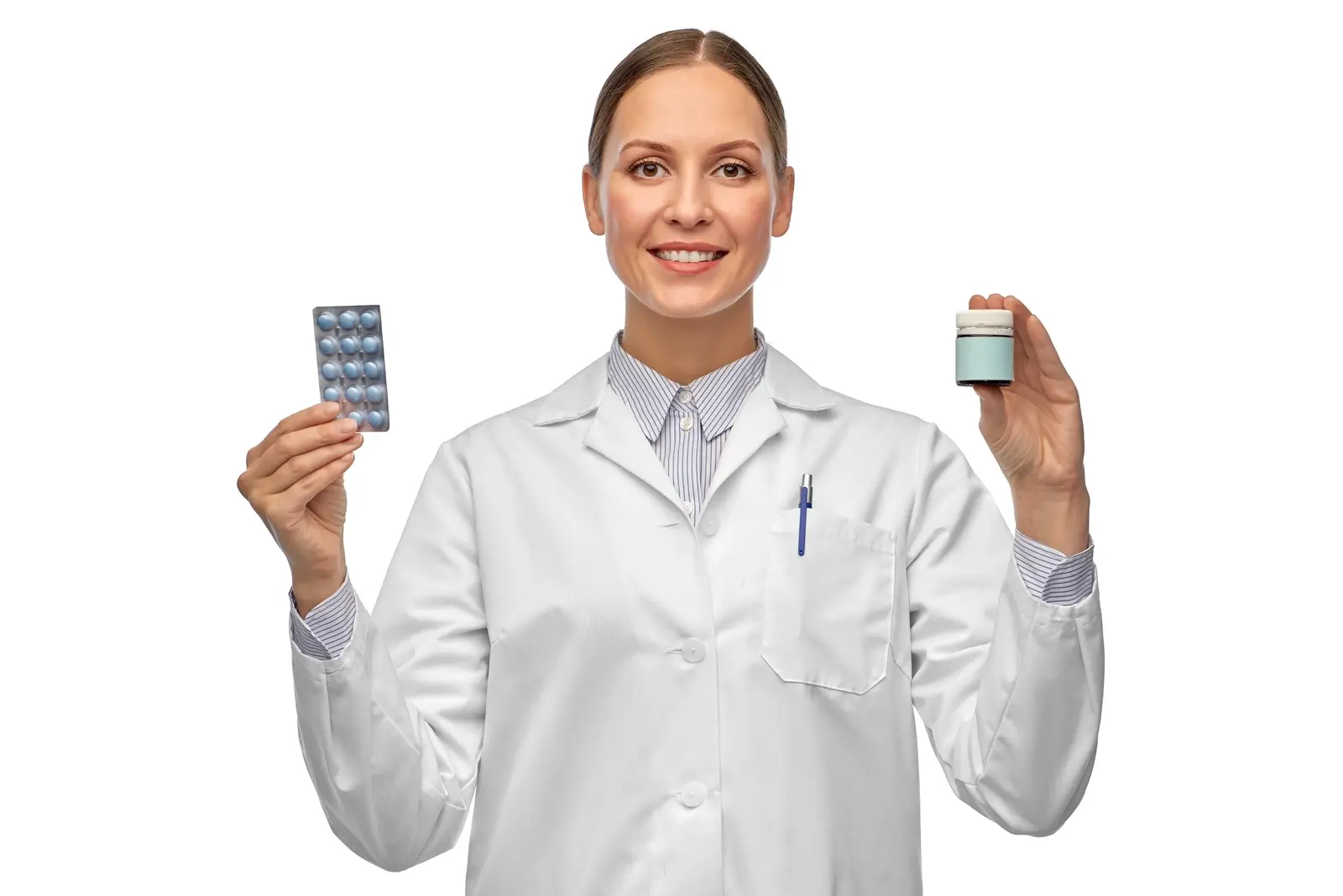 Doctor comparing pills. Doctor holding two types of pills.
